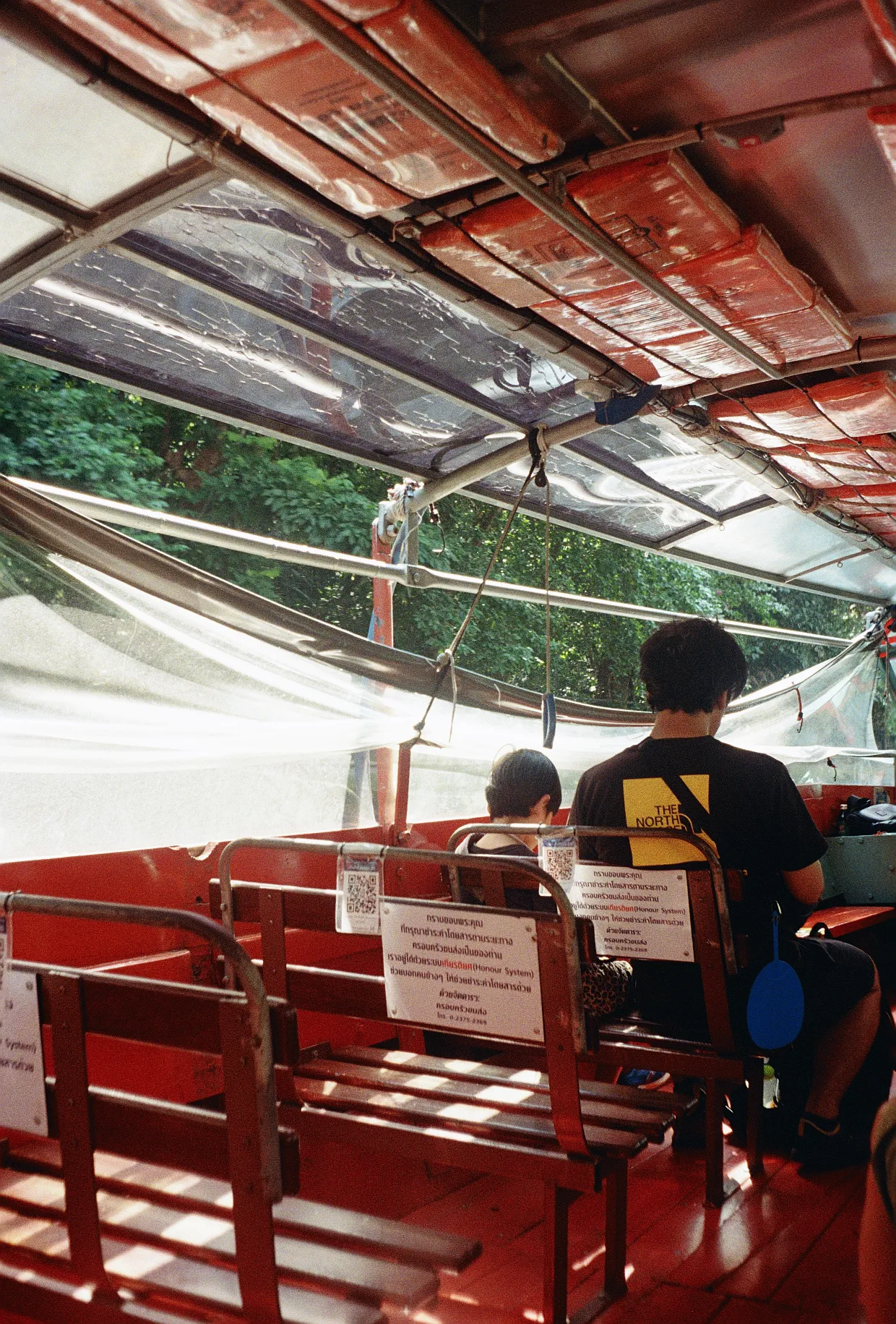 On a river bus in Bangkok.