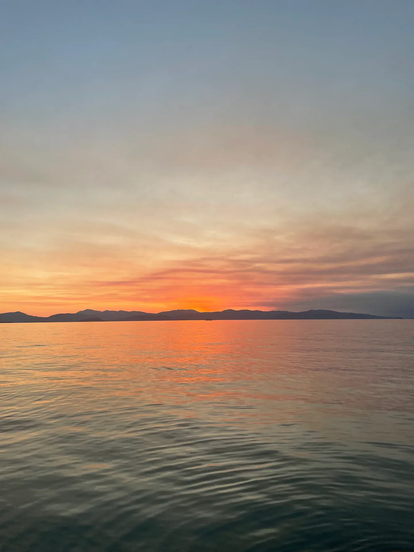 A beautiful sunset over the sea in Aegina, Greece.